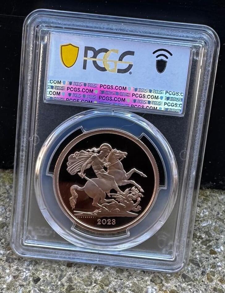 PCGS-graded 2023 British gold sovereign coin encased in protective plastic holder with certification label