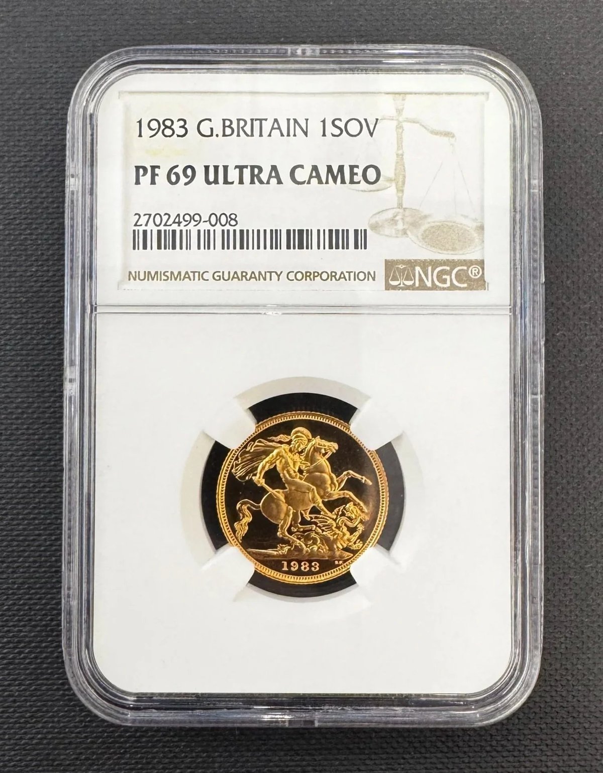 1983 British one sovereign gold coin graded PF 69 Ultra Cameo by NGC, encased in protective holder